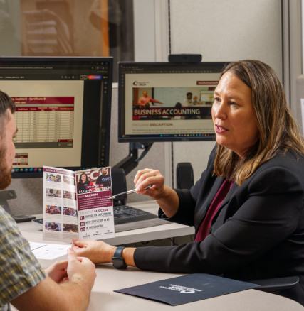 Admissions speaking with a student regarding programs