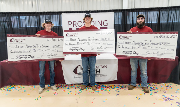 Manhattan Tech Students being awarded a scholarship at National Signing Day