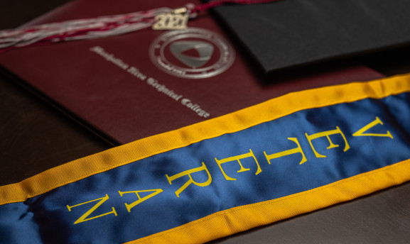 Veteran graduation regalia with a cap, tassel, and mortarboard