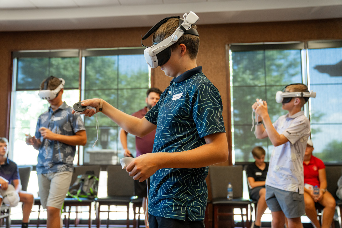 Participant of First Tee Manhattan wearing a VR headset during Immersive Career Exploration